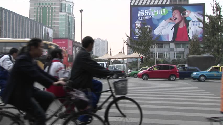 BEIJING, CHINA - CIRCA 2009: Large amounts of traffic pass by with modern billboards in the background, circa 2009 in Beijing.