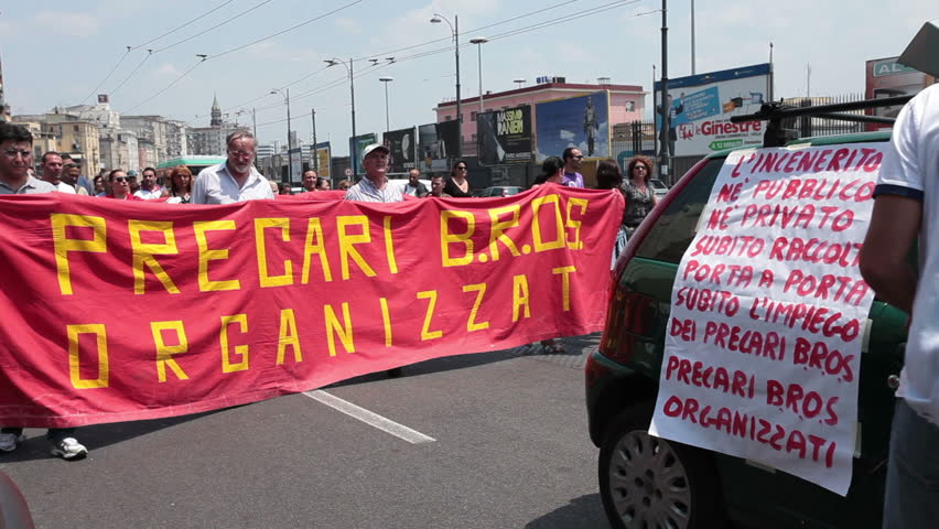 NAPLES, ITALY - MAY 26: Protesters carry banners demonstrating on employment and financial problems in their country. May, 26 2011 in Naples, Italy. City center. Unemployment and financial crisis.