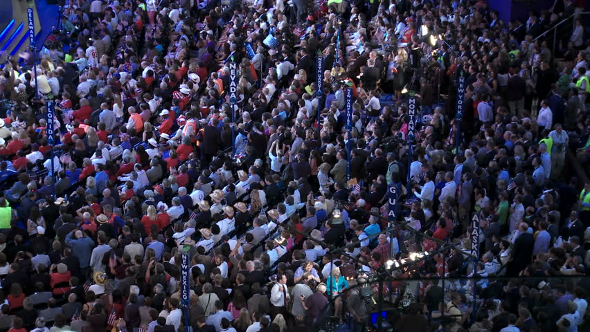 The crowd at Pepsi Center gives former President Bill Clinton a standing ovation as they wave flags and cheer during the Democratic National Convention in Denver Colorado.