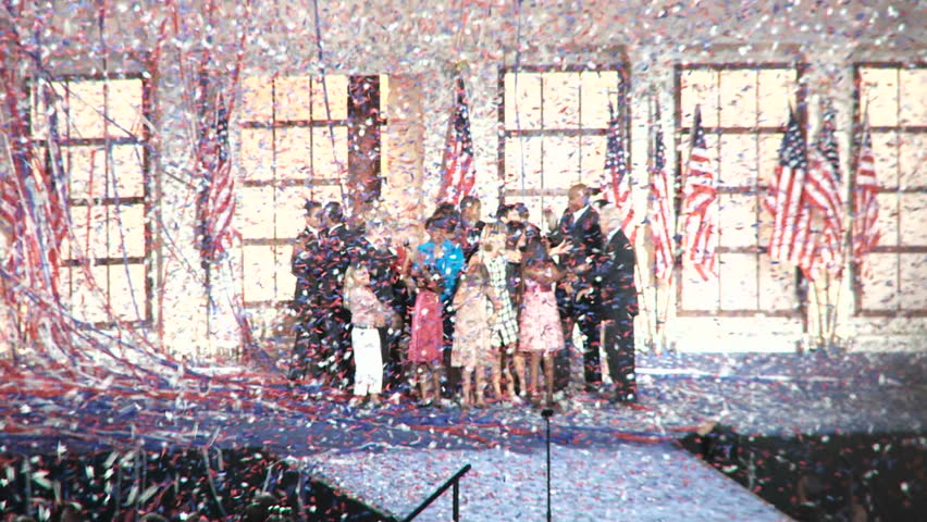 DENVER, COLORADO - CIRCA 2008: Presidential Nominee Barack Obama and his Vice Presidential pick Joe Biden celebrate with their families as confetti falls at the end of the 2008 Democratic National Convention.