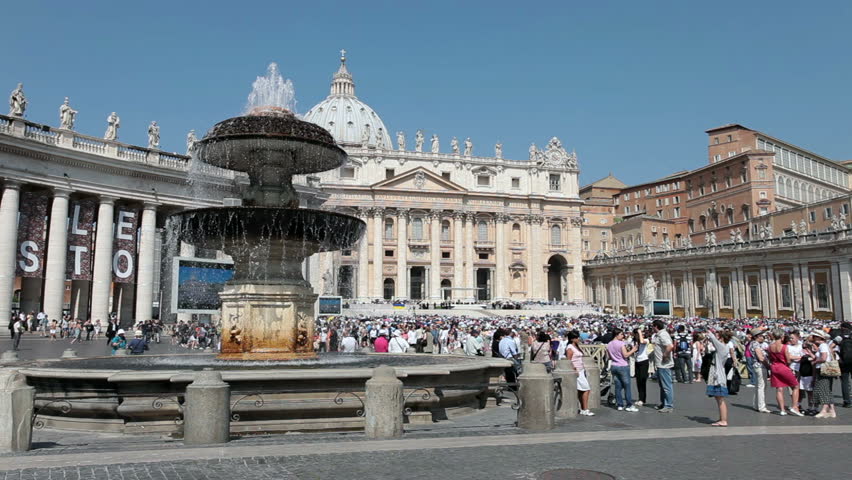 Tourists and pilgrims at St Peter Square to listen to Pope on steps of Cathedral May 25, 2011. Rome, Italy. Wisdom to Catholic church members. Fountain in squaret.