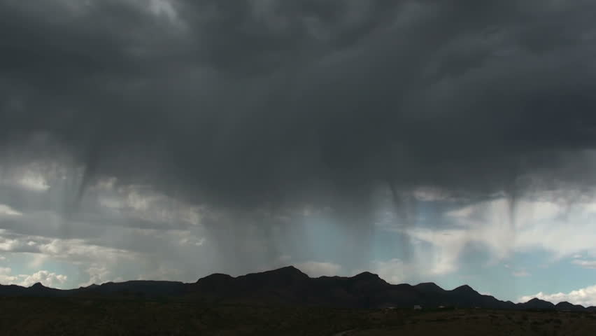 Time Lapse, Rain shafts sweep across Arizona desert mountains. 