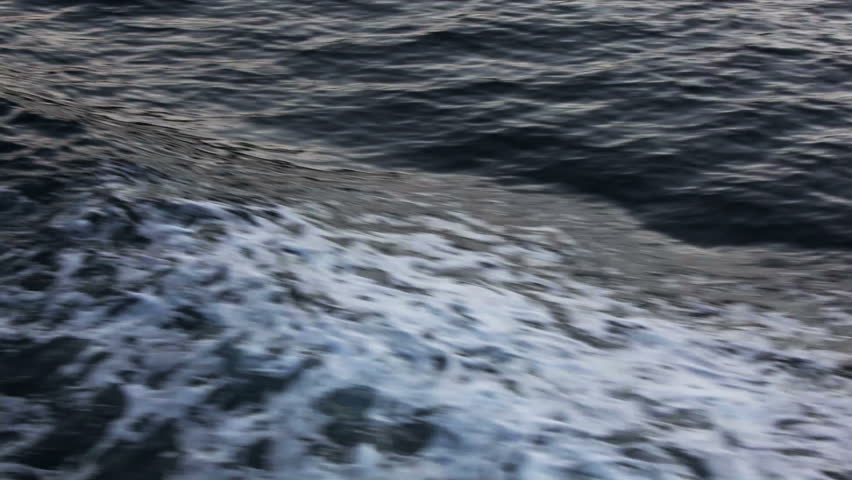 water ripple at sea sunset - view from ship