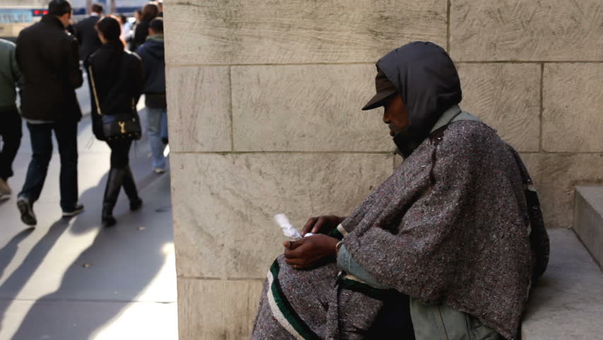 NEW YORK CITY, NY - NOVEMBER 25: Homeless man asking for food during Black Friday shopping spree on November 25, 2011 in New York City, New York. 