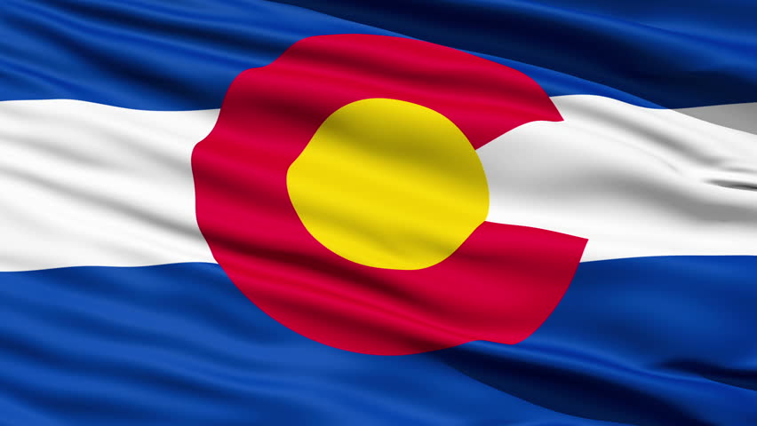 Waving Flag Of The US State Of Colorado with a stylised design depicting the red earth, golden sunshine, snow-capped mountains and blue skies.