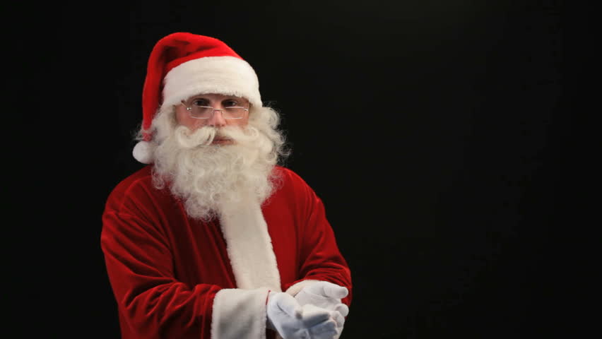 Santa blowing snow in front of camera then crossing arms