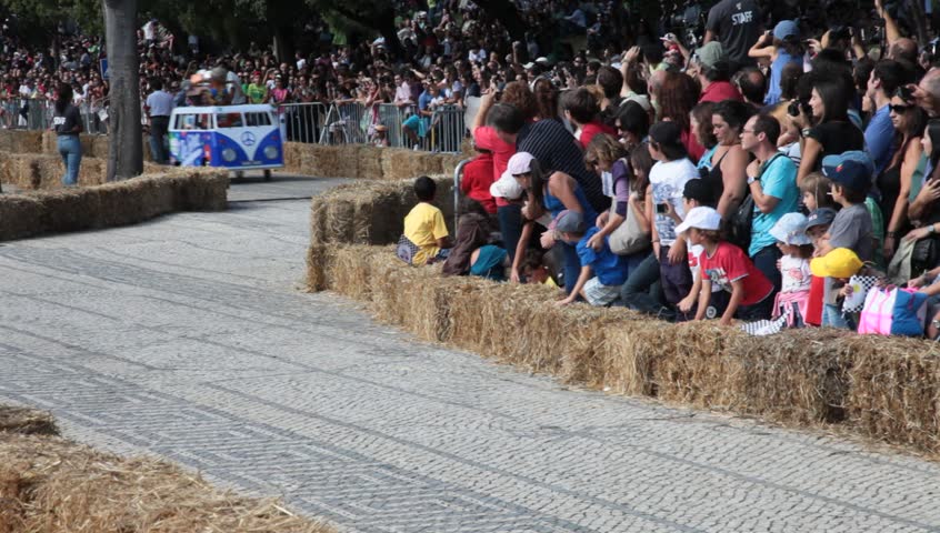 LISBON, PORTUGAL - SEPT 4:  Vehicles participate in Red Bull Soapbox race with Volkswagen Combi / Camper Van theme on Sept. 4th, 2011 in Lisbon, Portugal.