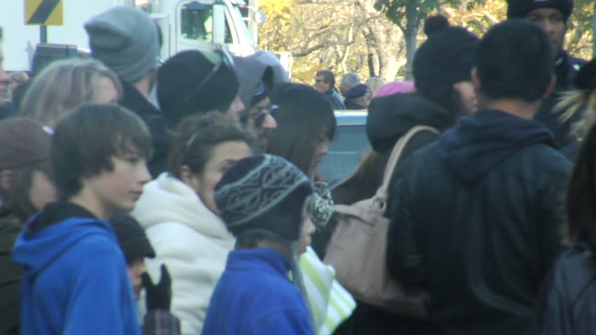 NEW YORK - NOVEMBER 24: Parade-goers scatter after end of Macy's Thanksgiving Day parade November 24, 2011 in New York 