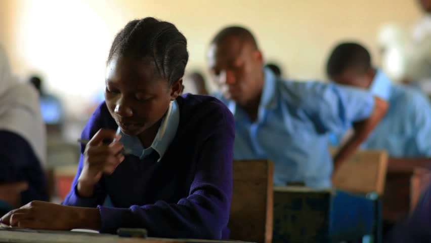 KENYA, AFRICA - AUGUST 2010: Students taking a test in class in a school in a village in Kenya two hours north of the African city Mombassa on Aug 2010 in Kenya.