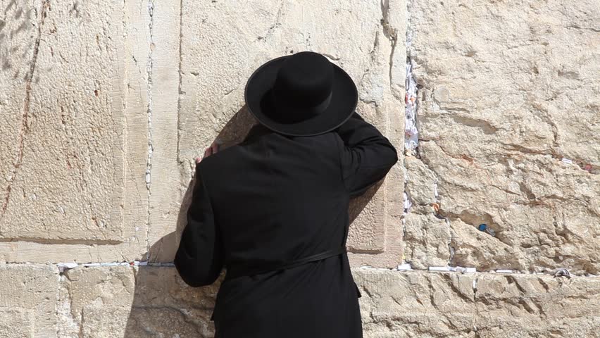 JERUSALEM, ISRAEL - CIRCA OCT 2011: Orthodox Jews pray at the Western Wall circa October 2011 in Jerusalem.