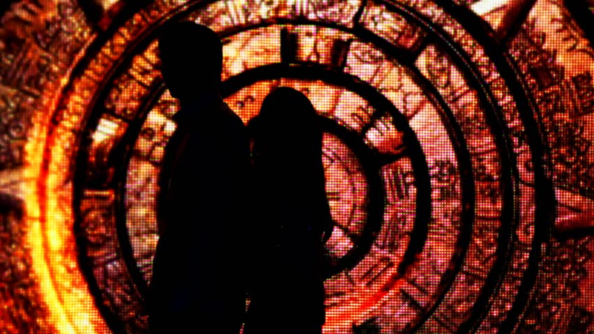 silhouette young couple who had their backs to each other in fabulous decoration tunnel, then turn around and kiss