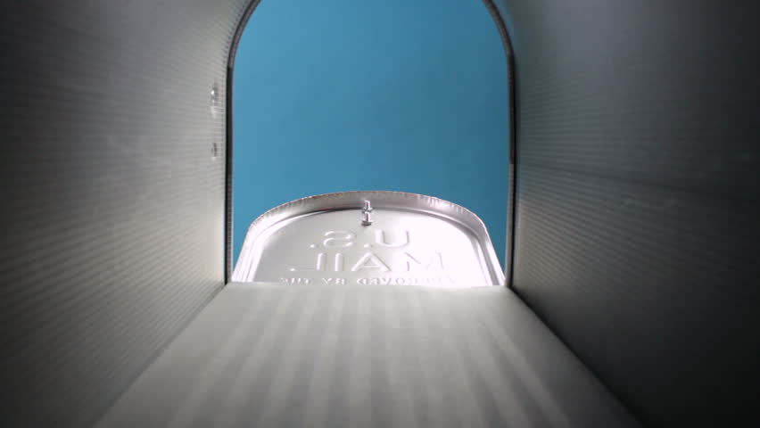 A mailbox is opened and mail is removed