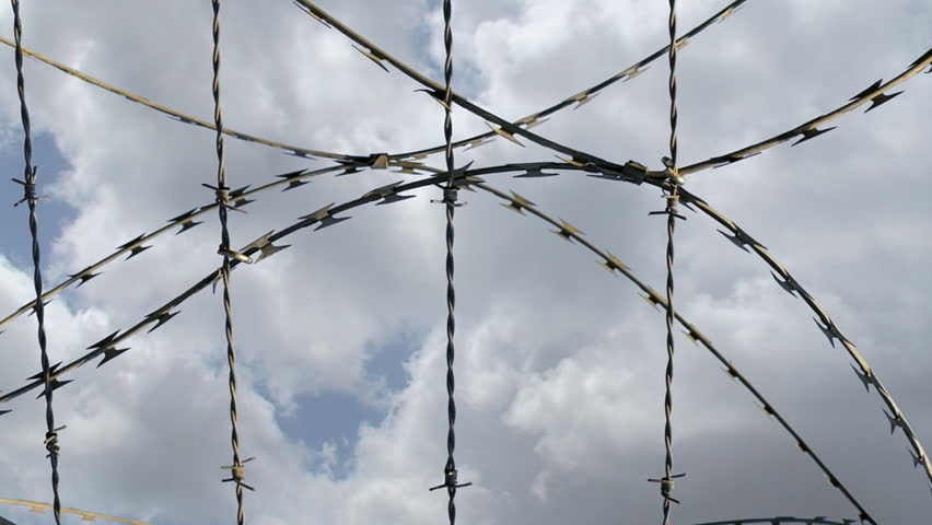 Time lapse of barbed wire against sky