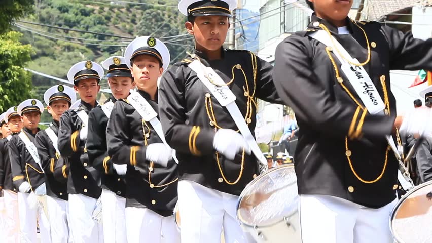 BANOS DE AGUA SANTA, ECUADOR - DECEMBER 16: Young students march in a parade for the anniversary of the cantonization of the city of Banos de Agua Santa, Ecuador on December 16, 2011.