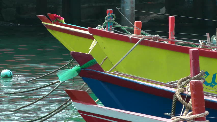 fishing boats at the pier. pitching