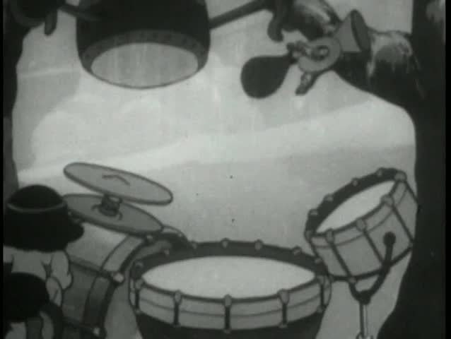 Native American baby playing drums