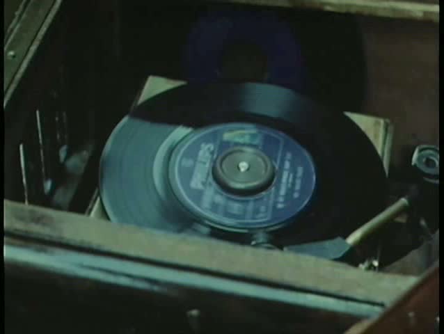 Close-up 45 rpm record playing on vintage record player