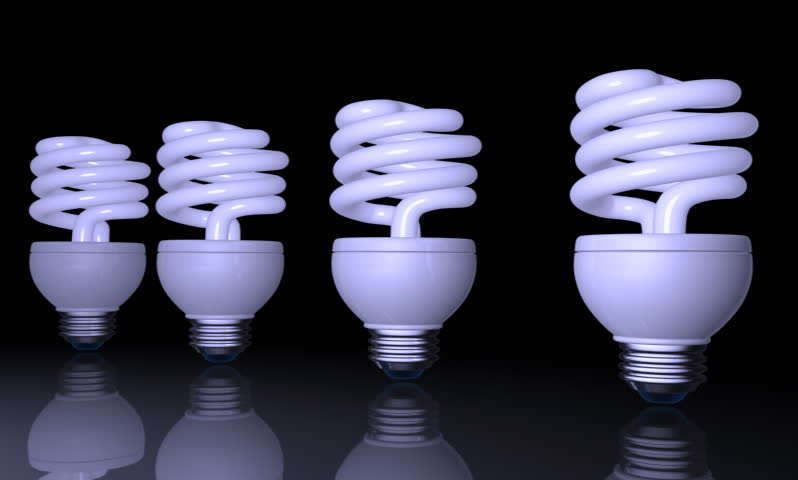 footage of a spiral shape CFL light in black background 