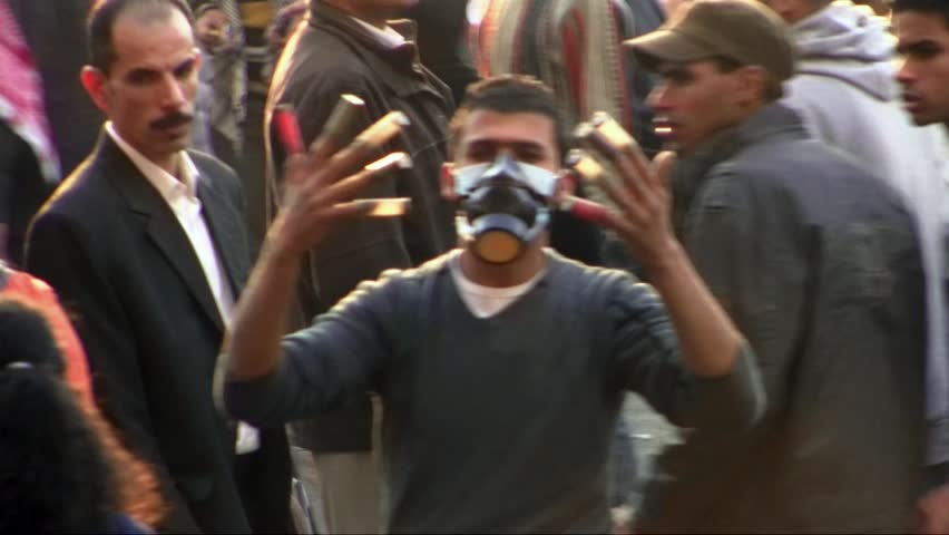 CAIRO, EGYPT - NOV 19: Protester in Tahrir Square shows the cartridges of the non offensive weapons used by the police during the clashes on November 19, 2011 in Cairo, Egypt. 