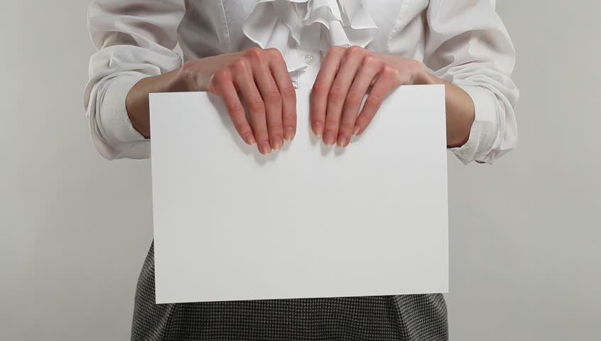 Female hands tearing blank sheet of paper to pieces and scattering them