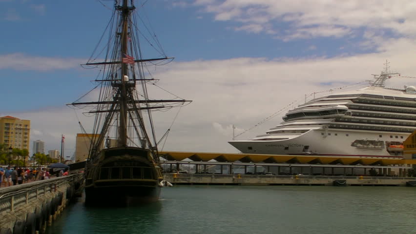 SAN JUAN, PUERTO RICO - MARCH 3, 2011 - Historic ship "the Bounty"  docked in front of Carnival Cruise Ship in San Juan Harbor. 