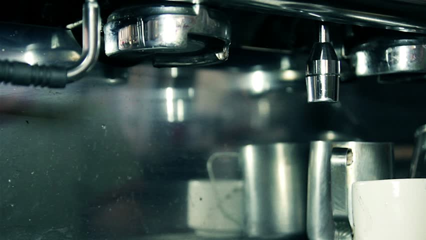 Making coffee espresso in a bar with professional machine