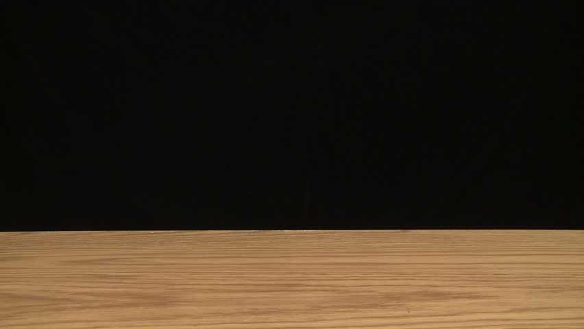 Time lapse of a growing stack of hardcover books