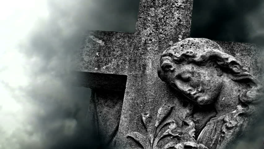 Timelapse clouds flowing past graveyard statue