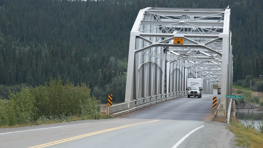 CANADA CIRCA AUG 2010: Vacation recreation vehicle truck and trailer on famous ALCAN Highway in British Columbia, Canada. Summer route to Alaska.