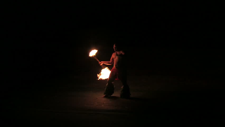 LAIE, OAHU, HAWAII CIRCA FEB 2008: BYU Hawaii student twirls fire baton at night and demonstrate Polynesian Island customs to earn tuition money in Hawaii circa February  2008 in Lake Oahu, Hawaii.