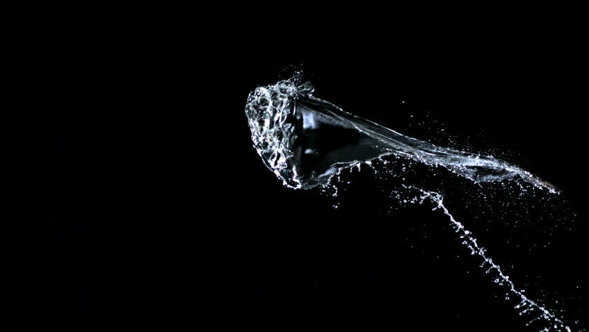 Water splash against black drop