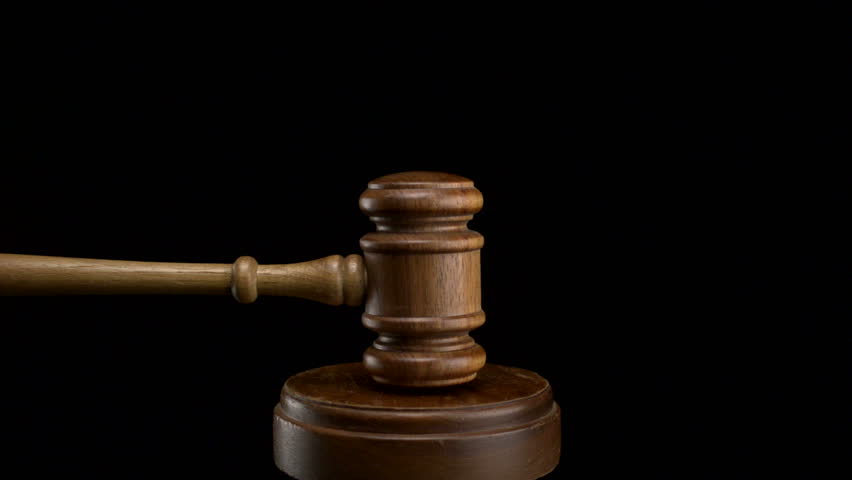 Gavel pounded on block