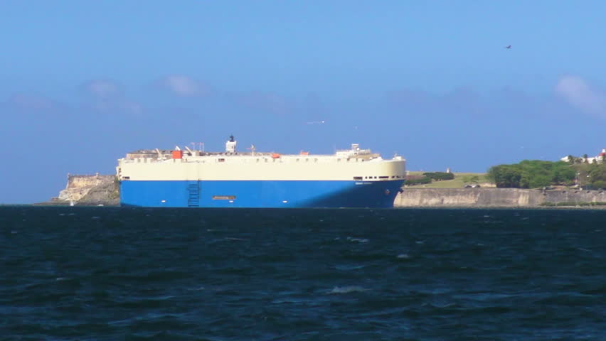 Cargo Ship entering San Juan Bay - Fort El Morro in background