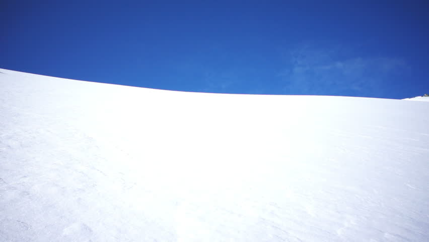 skier skiing in fresh powder snow in slow motion 
