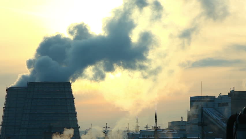 winter sunset with smoke pollution from termal station