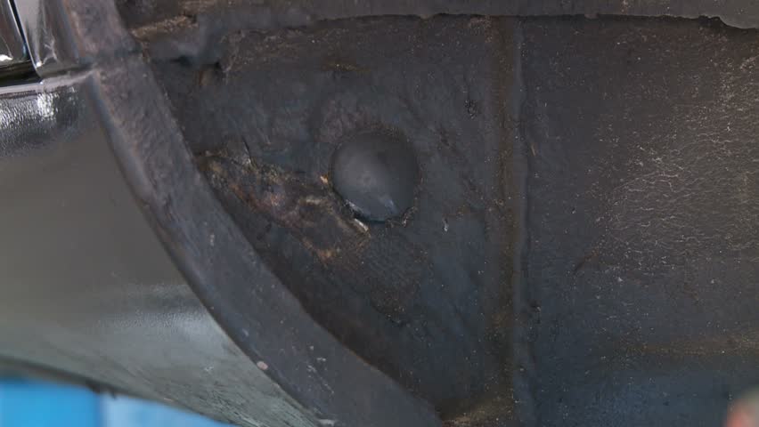 Mechanic fixing car part