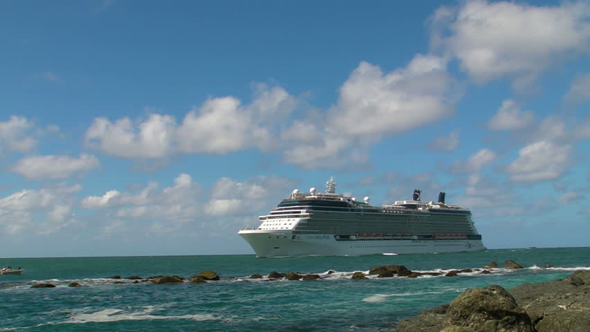 SAN JUAN, PUERTO RICO - CIRCA JAN 2012: Big cruiseship close to rocky shore circa January 2012 in San Juan, Puerto Rico.