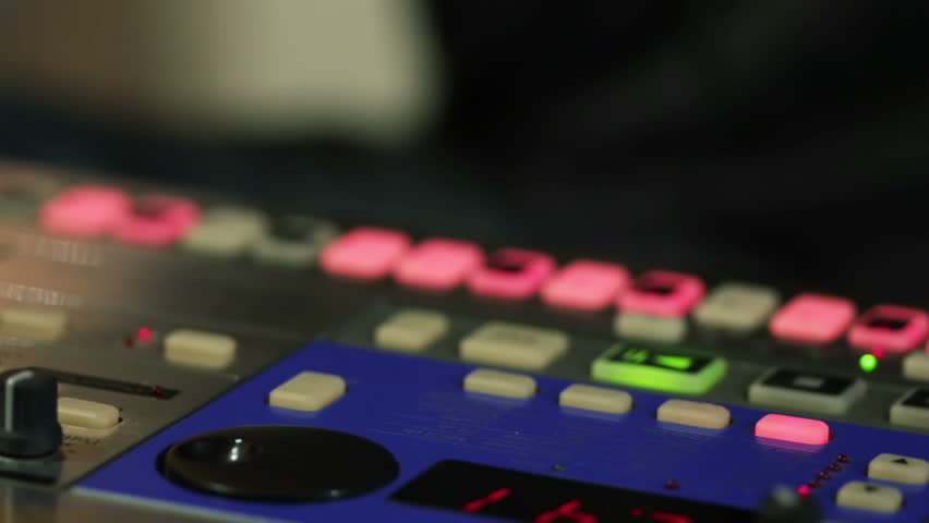 DJ creating music on an analogue synthesizer