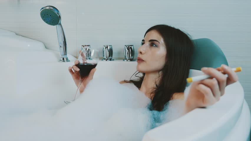 Girl Drinking A Glass Of Wine In The Bath Tub Stock ...