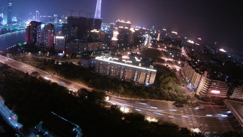 Cars go to bridge through Pearl river at night, time lapse