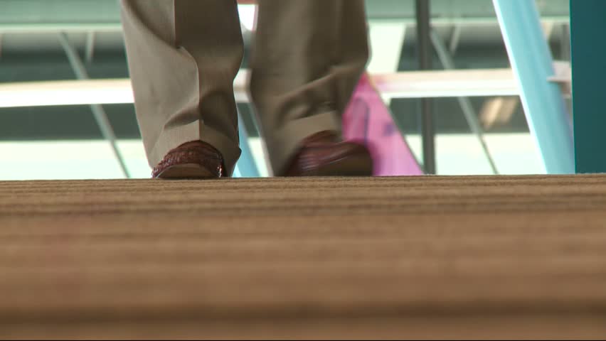 People walking on carpeting