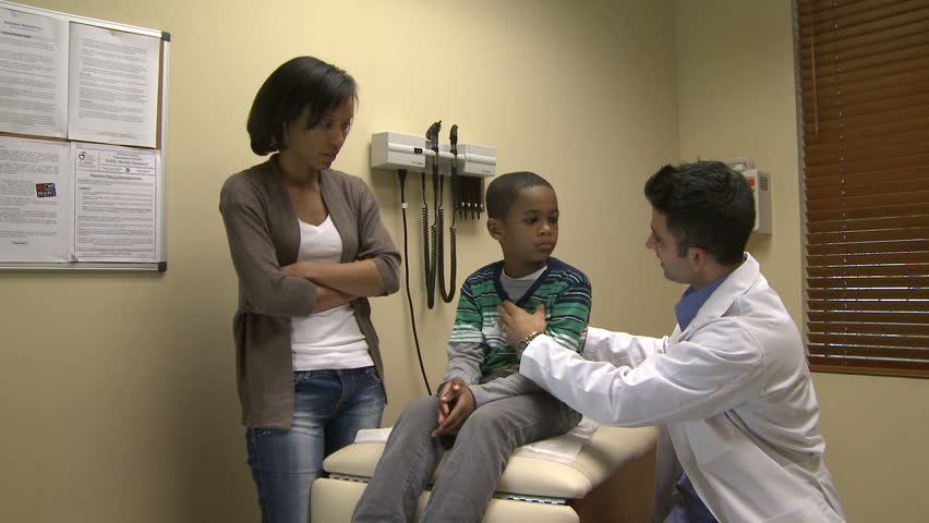 Mom watches as son get a checkup (8 of 8)