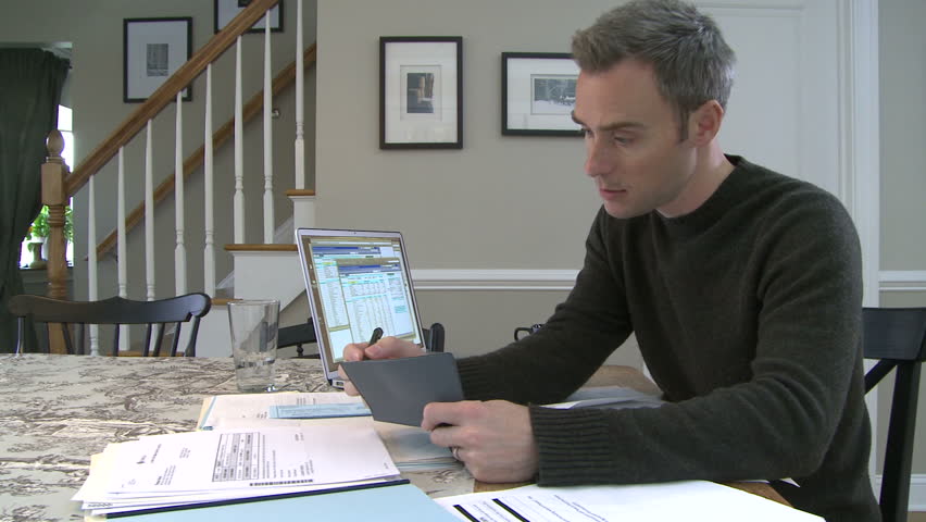 Man working on bills and finances