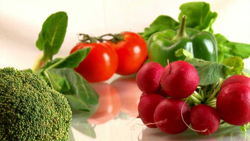 Vegetables on glass table, camera dolly. Healthy lifestyle.