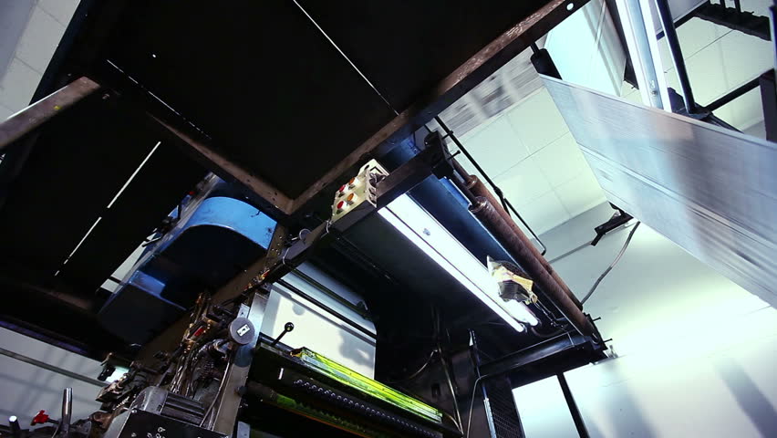 huge automatic newspaper machine in a print shop