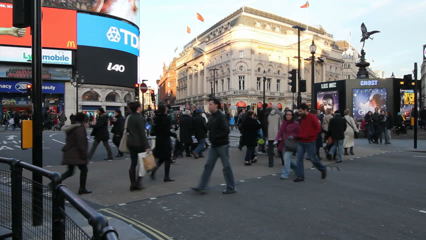 LONDON, UK - DECEMBER 27: Tourists, busses and other traffic on Piccadilly Circus drive by on December 27, 2011 in London, UK. Piccadilly Circus is one of the main entertainment areas of London.