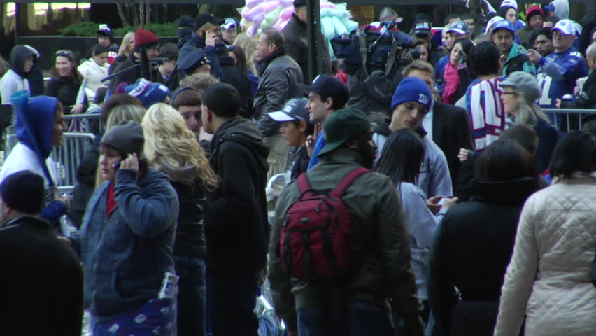NEW YORK - FEBRUARY 7: Parade-goers scatter after the ticker-tape parade in honor of the Super Bowl Champions New York Giants on February 7, 2011 in New York. 