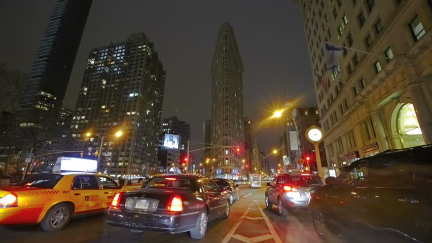 NEW YORK CITY - Feb 10: Timelapse of the Crossing at Flatiron Building at nighttime on February 10, 2012 in New York City, USA. 
