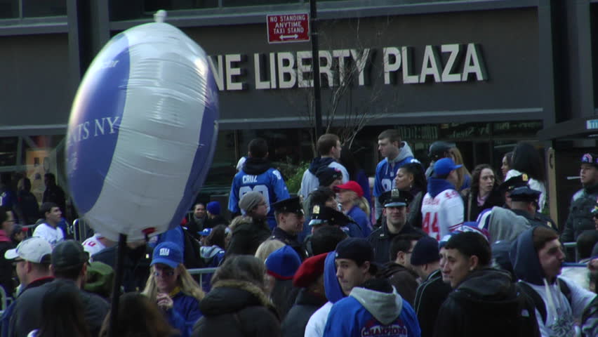 NEW YORK - FEBRUARY 7: Parade-goers scatter after the ticker-tape parade in honor of the Super Bowl Champions New York Giants on February 7, 2011 in New York. 
