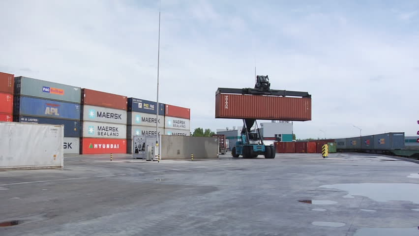 NOVOSIBIRSK, RUSSIA - MAY 20: The Crane moves containers on a logistical warehouse in the open air on May 20, 2010 in Novosibirsk, Russia.